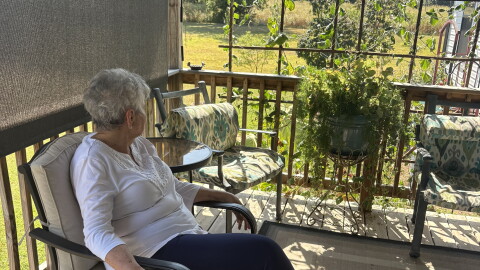 JaNelle Rutledge looks out over her home near Slaughterville.