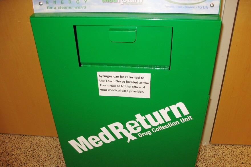 Used needles are deposited in sharps containers like this one at the police station.