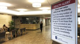 A sign prohibiting all children under 12 and unvaccinated adults stands at the entrance to PeaceHealth Southwest Medical Center in Vancouver, Wash. CREDIT: GILLIAN FLACCUS/AP