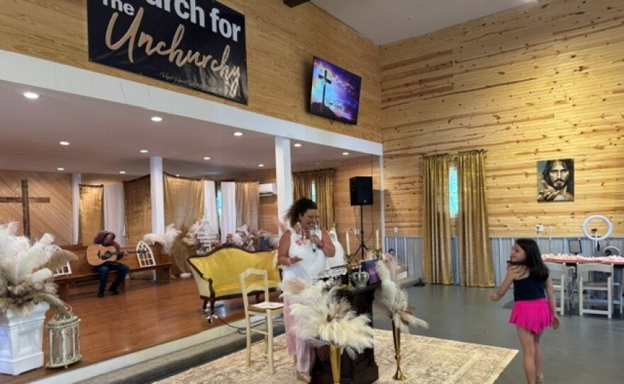 Kassie Bennett is an ordained minister and leads the church service