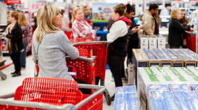 Shoppers wait in line for Apple iPhone purchases during a Black Friday sale at a Target store, Friday, Nov. 23, 2018, in Newport, Ky.