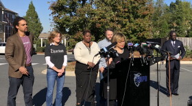 Charlotte Mayor Vi Lyles announced updated statistics on policing and affordable housing with several City Council members behind her at the Brightwalk community near Uptown on Friday.