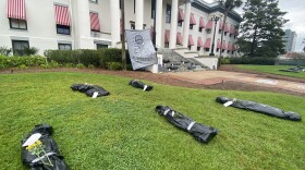 The Florida Prisoner Solidarity created a mock-graveyard on the capitol grounds.