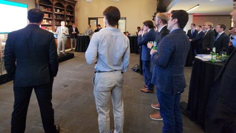 Attendees watch a Florida DOGE panel in Washington, D.C.