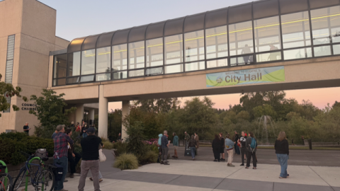 People gather outside Eugene City Hall on Monday, Sept. 14, after the council chambers reached capacity. The meeting included a 90-minute public comment section where speakers called for restrictions on data center development.