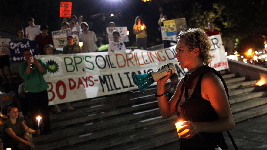 Protesters gathered for a candlelight vigil Thursday in New Orleans to mark the one-month anniversary of the BP oil spill.