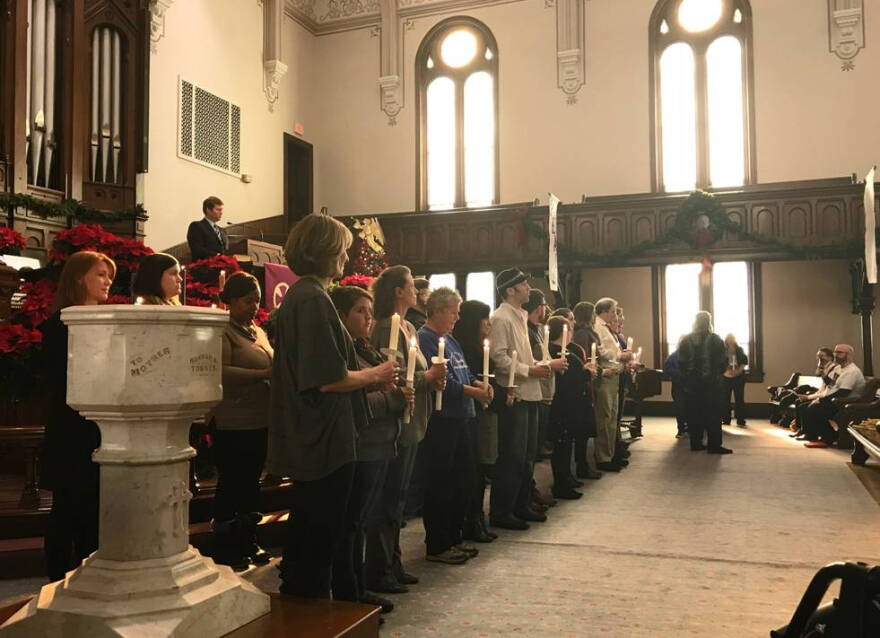 Candles were lit to commemorate 58 people who died while experiencing homelessness in Indianapolis this year. A moment of silence was also held for unreported deaths.