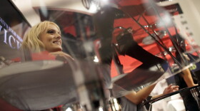 Adult film star Stormy Daniels, left, signs autographs at the AVN Adult Entertainment Expo in Las Vegas, Sunday, Jan. 11, 2009. (Jae C. Hong/AP)
