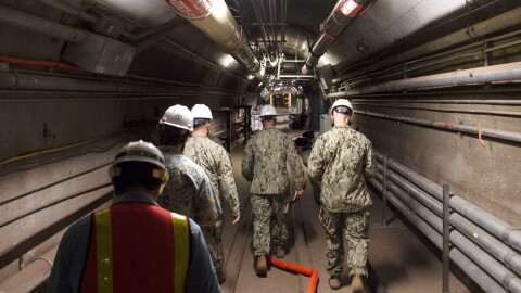 Rear Adm. John Korka, Commander, Naval Facilities Engineering Systems Command (NAVFAC), and Chief of Civil Engineers, leads Navy and civilian water quality recovery experts through the tunnels of the Red Hill Bulk Fuel Storage Facility, near Pearl Harbor, Hawaii, on Dec. 23, 2021. 