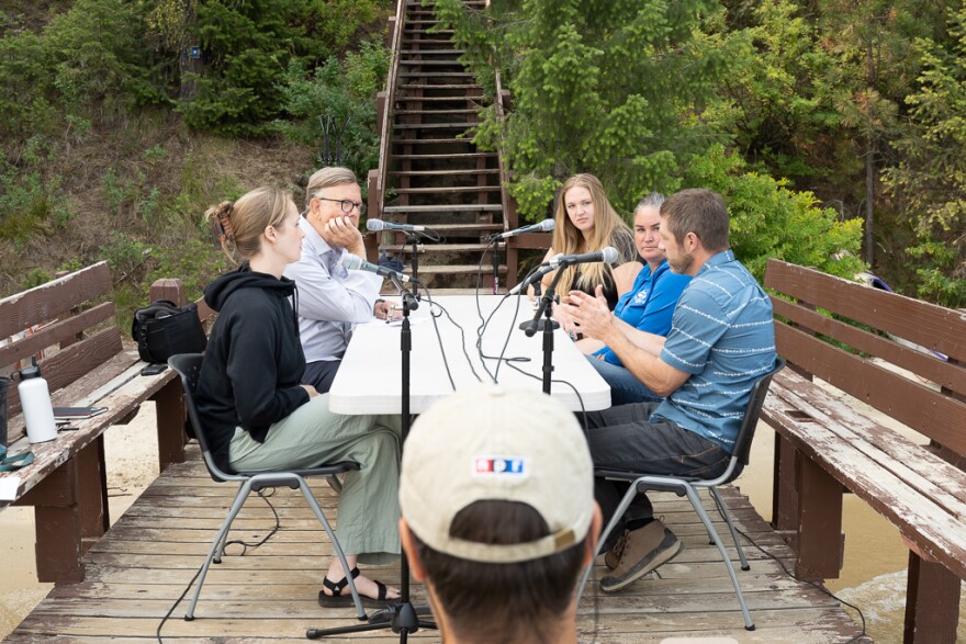 Boise State Public Radio journalists learn about the issues facing Payette Lake on the dock of the McCall Outdoor Science School from the University of Idaho. Left to right: Idaho Matters senior producer Frankie Barnhill, Morning Edition host George Prentice, University of Idaho graduate student Heather Crawford, McCall Water Systems Manager Sabrina Sims, McCall Public Works Director Nathan Stewart.