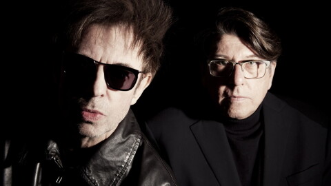 two men posing for a photograph 