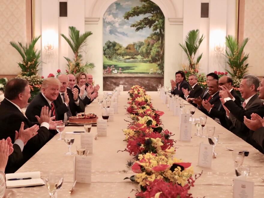 President Trump participates in a working luncheon hosted by Singapore's Prime Minister Lee Hsien Loong in Singapore on Monday. Officials from both delegations also attended the luncheon.