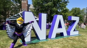 The Nazareth University Golden Eagle mascot, Swoop, celebrates the school rebranding from a college to a university.