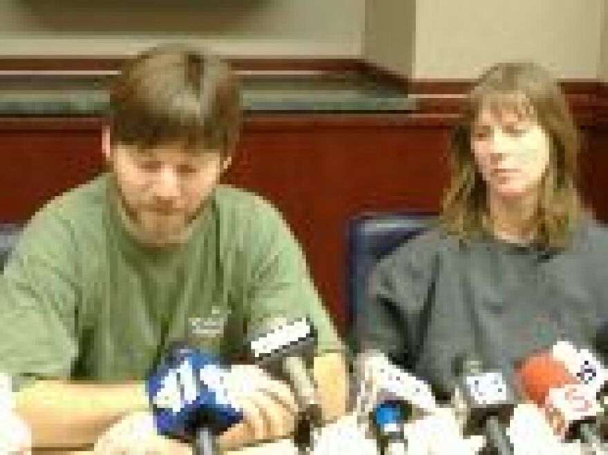 Jerry and Lisa Toops speak to reporters in St. Louis about their brush with death when the Taum Sauk Reservoir ruptured and destroyed their home near Lesterville Dec. 14.