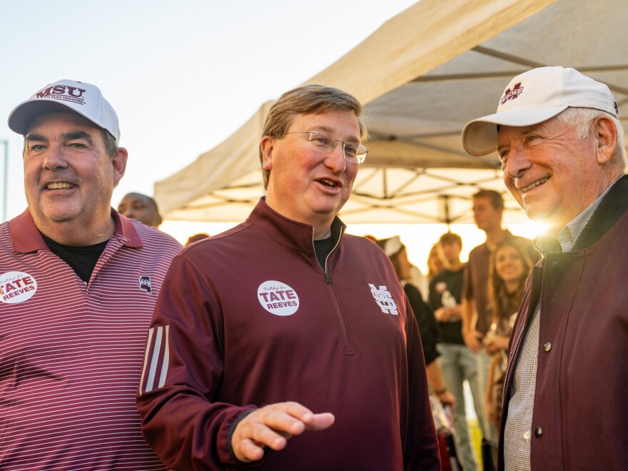 Mississippi Gov. Tate Reeves, center, greets supporters ahead of a football game at Mississippi State University on November 04, 2023 in Starkville, Mississippi.