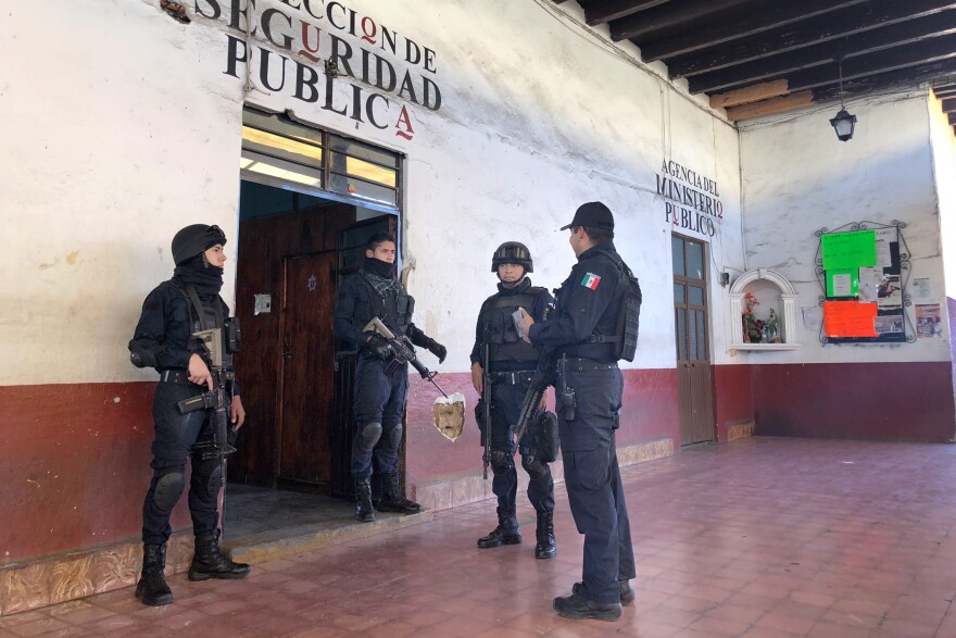 Police officers of Tancitaro's 80-member force gather before going out on patrol.