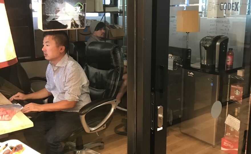 Tan Ly works in a WeWork space in downtown Washington, D.C. WeWork is among several companies that offer workspaces around the world.