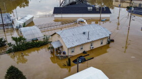 An aerial view of homes submerged under flood waters from the North Fork of the Kentucky River in Jackson, Kentucky, on July 28, 2022. (Leandro Lozada/AFP via Getty Images)