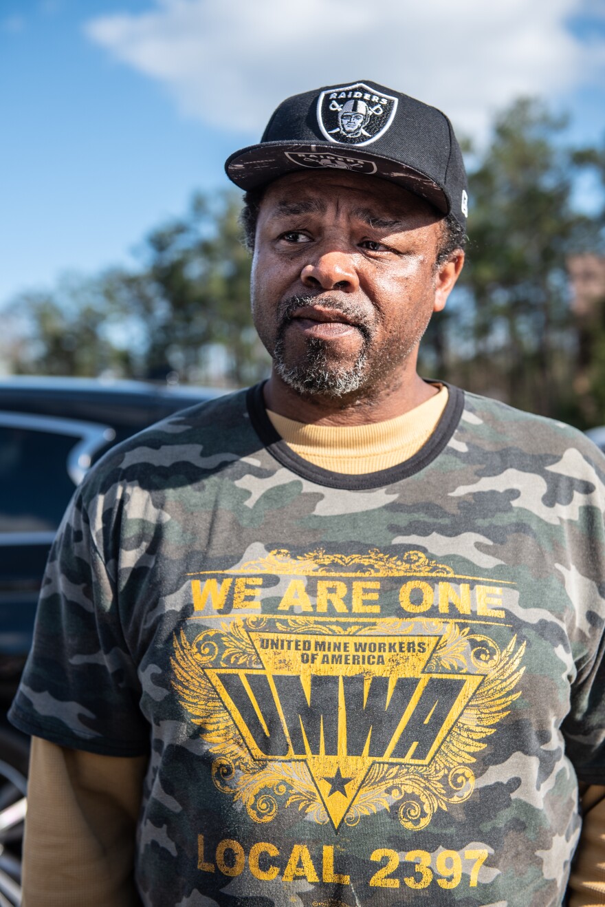 Johnny Murphy stands in the crowd at a union rally on March 23, 2022, in Brookwood, Alabama.