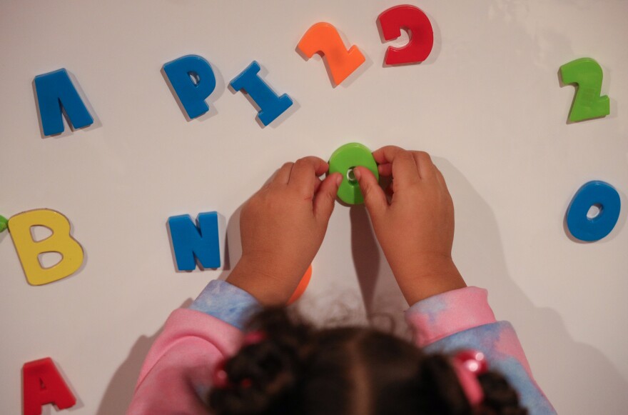 Children learn through play with magnetic letters and numbers at Fun Times With Titi Childcare on Monday, October 27, 2025.