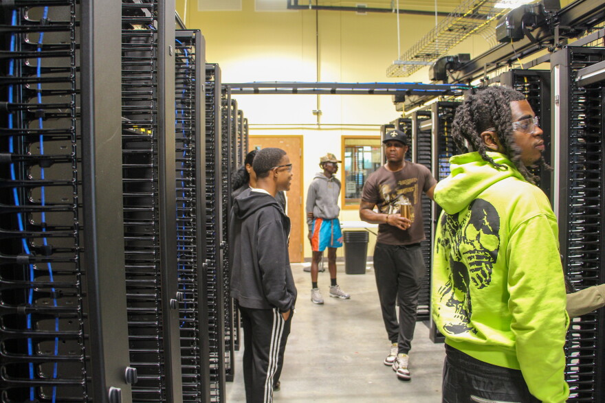 A mini data center at Louisiana Delta Community College where students practice laying fiber and setting up servers.