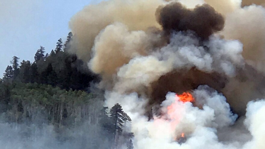 Flames and smoke billow skyward as a wildfire burns near Durango, Colo. on June 7, 2018. The 416 Fire continued to burn more than 27,000 acres Wednesday morning, causing the closure of a nearby national forest.