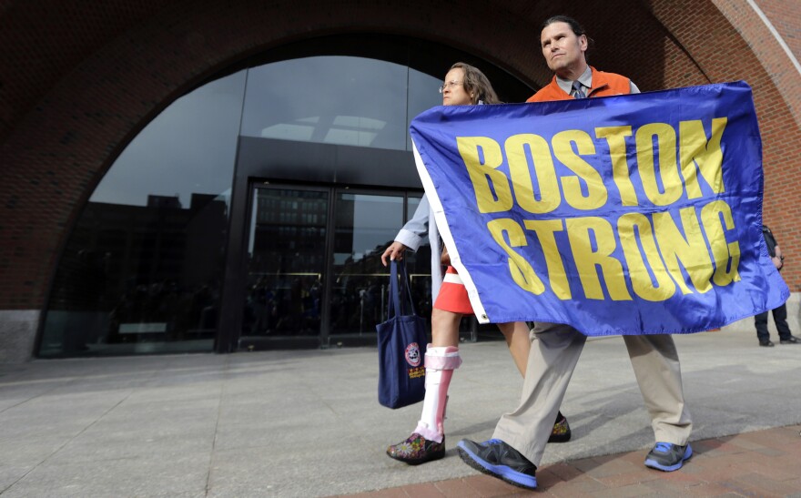 Carlos Arredondo — who is credited with saving the life of Boston Marathon bombing survivor Jeff Bauman, who lost both of his legs in the blast —leaves the Moakley Federal Courthouse with his wife, Melida, after the verdict in the penalty phase of the trial of Dzhokhar Tsarnaev on May 15, 2015.