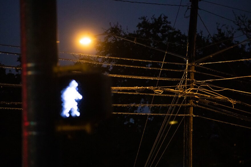  Ice hangs from electric lines in Austin during a winter storm on Feb. 2.