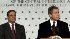 President Bush (right) addresses employees of the Central Intelligence Agency as CIA director George J. Tenet looks on in March 2001.  Under Tenet's leadership, the CIA would develop its role in the war on terrorism after the September 11, 2001, attacks.