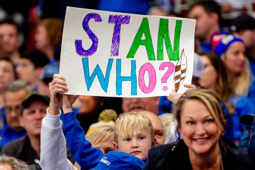 A young St. Louis Battlehawks fans hoists up a sign referring to Los Angeles Rams owner Stan Kroenke, who pulled the team out of St. Louis in 2016, on Sunday, March 12, 2023, during the St. Louis Battlehawks’ XFL home opener against the Arlington Renegades at the Dome at America’s Center in downtown St. Louis.