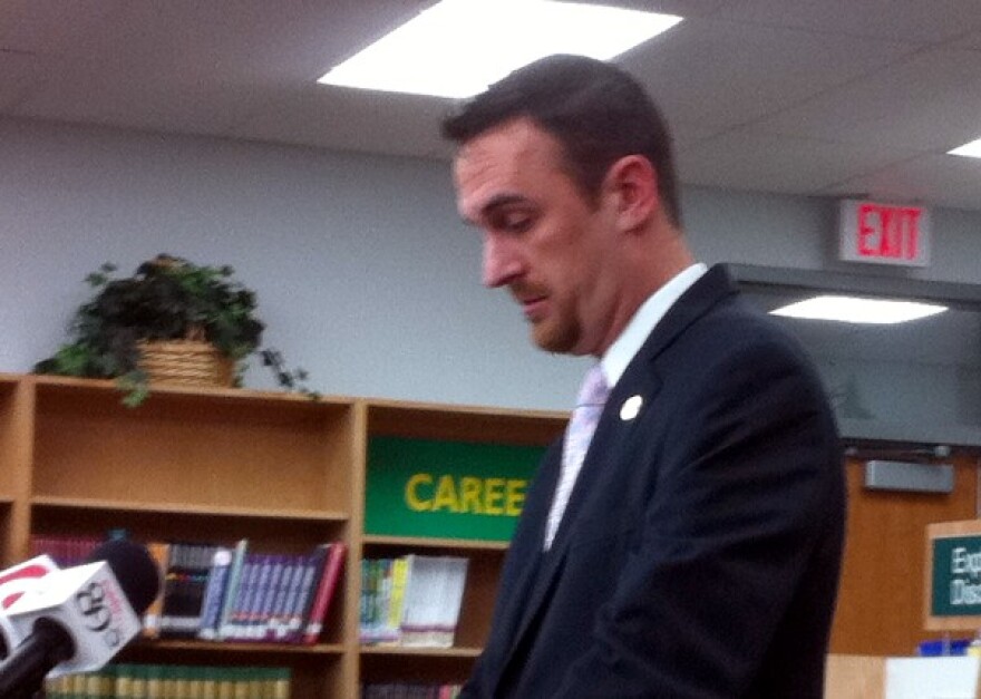 Shane Jewell makes check presentation at Lewis and Clark.