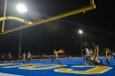 Lincoln Prep players celebrate a touchdown Friday night against St. Joseph Benton. Despite football being on the list of high-risk activities by the National High School Federation, schools in Missouri were able to take the field or courts this past weekend under varying amounts of safety measures.