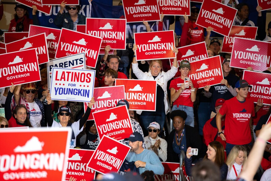 The day before the election for governor in Virginia, Glenn Youngkin supporters gather inside an airplane hanger in Chesterfield County to show their enthusiasm for the Republican candidate.