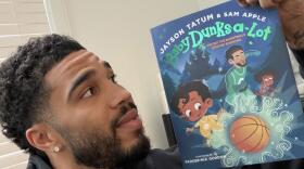 Co-author Jayson Tatum hold his new book, "Baby Dunks-A-Lot: The Day the Basketballs Stopped Bouncing." (Courtesy of Jayson Tatum)
