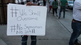 A protester outside the Yakima County Jail Wednesday, June 27 joins several others in calling for the release of detained immigrants. CREDIT: ESMY JIMENEZ/NWPB