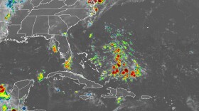 A satellite image shows an area of disturbed weather east of the Bahamas that will drift toward Florida this weekend.