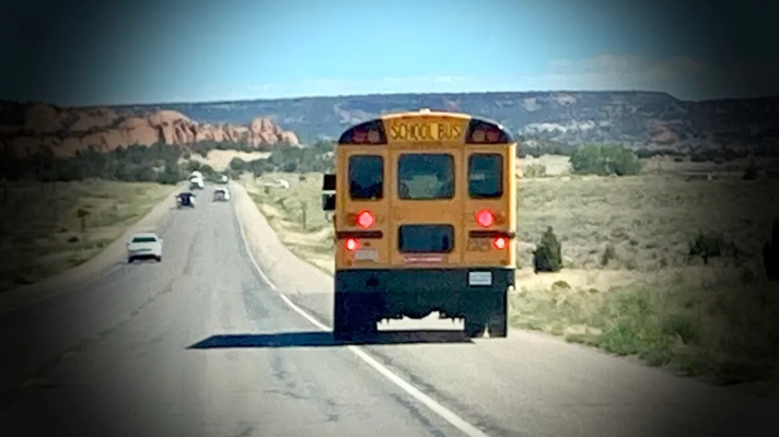 A school bus takes students home in rural New Mexico.