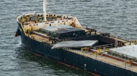 The W-Sapphire bulk carrier is seen anchored off Sandy Point the morning after an explosion occurred in one of its holds as it was leaving the Port of Baltimore. (Jerry Jackson/The Baltimore Banner)