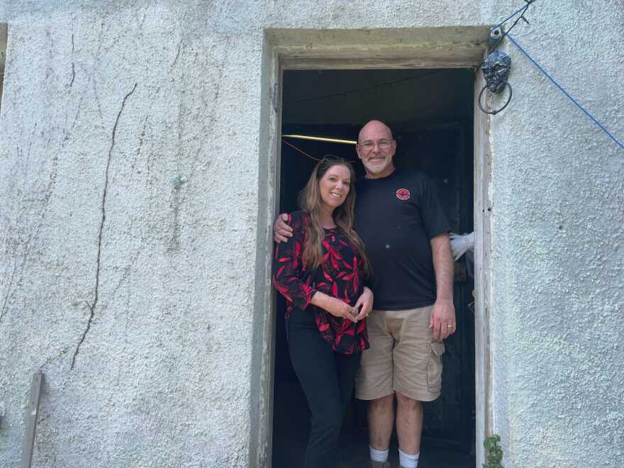 Cheryl and Lee Irwin stand just inside the threshold of one of their properties, the Old Gilchrist County Jail. Together, they are cleaning the space and helping to establish it as a paranormal destination. (Avery Lotz/WUFT News)