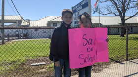 Jackson Dardar (L) says phy ed is his favorite class at Pointe-Aux-Chenes Elementary, and his sister Presley (R) says she loves her school. 