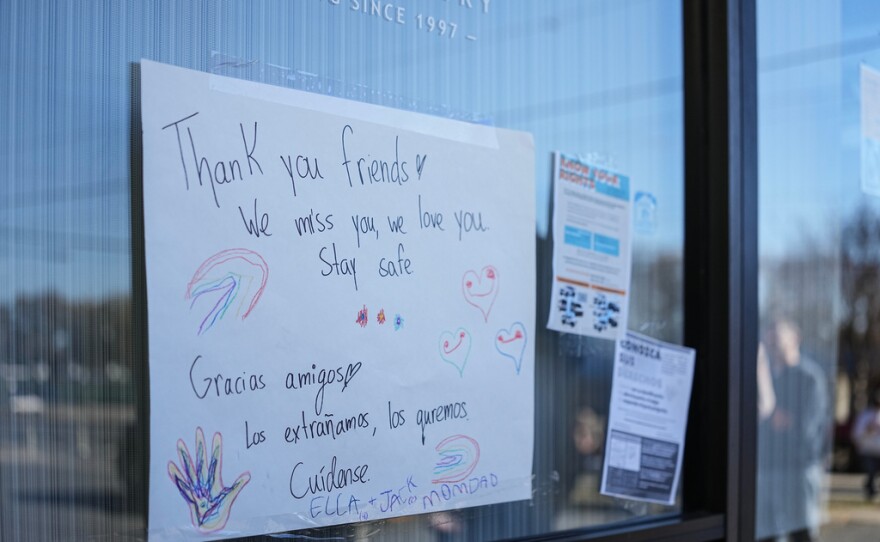 A sign of support is posted outside of Manolo’s bakery which is closed amidst federal law enforcement presence, Monday, Nov. 17, 2025, in Charlotte, N.C.