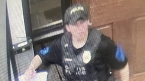 Screenshots from security footage on April 15, 2026, when officers from the Village of Gratis visited Cincinnati's Western Hills University High School on behalf of ICE.