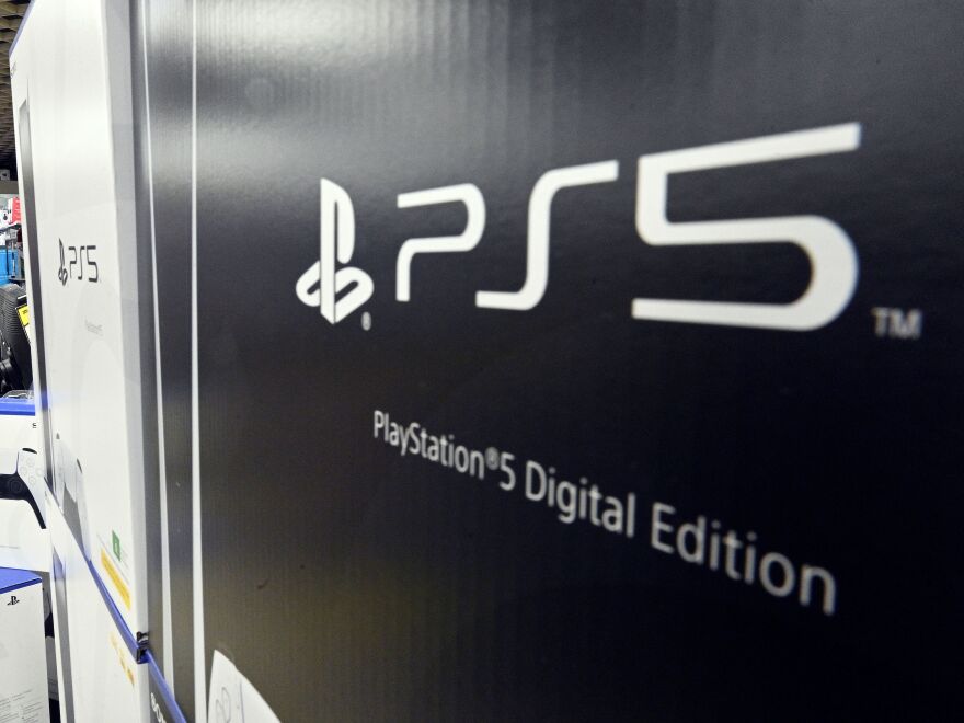 A customer waits in a queue inside an electronics store in Sydney on Nov. 12, 2020, on the day of the official launch of Sony's next-generation PlayStation 5 gaming console.