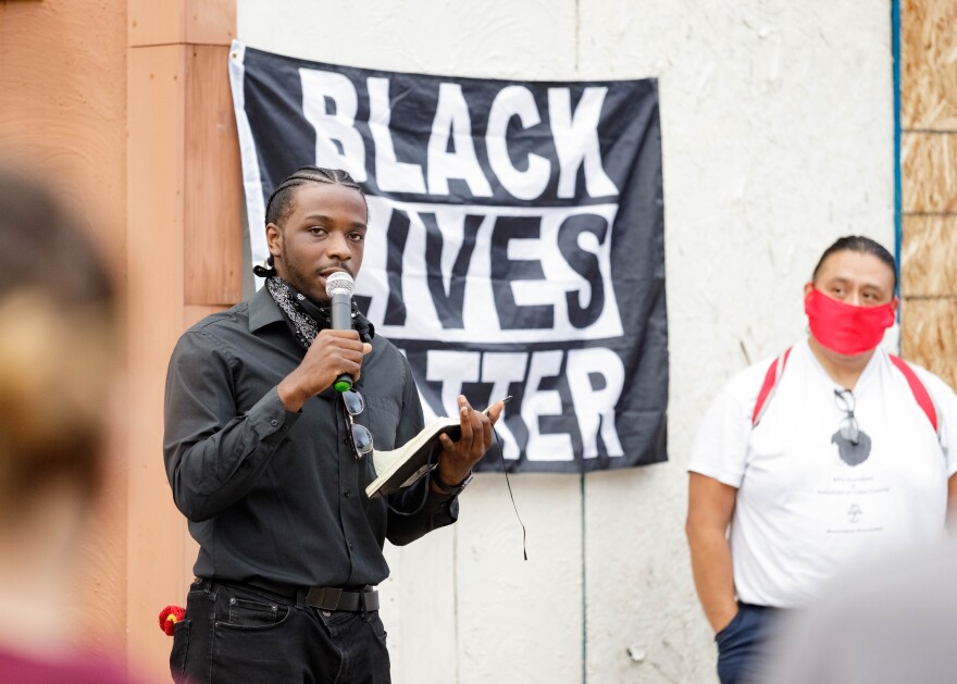 Donovan Hill, from ISU's Black Communication Association, spoke at Monday's demonstration in Uptown Normal.