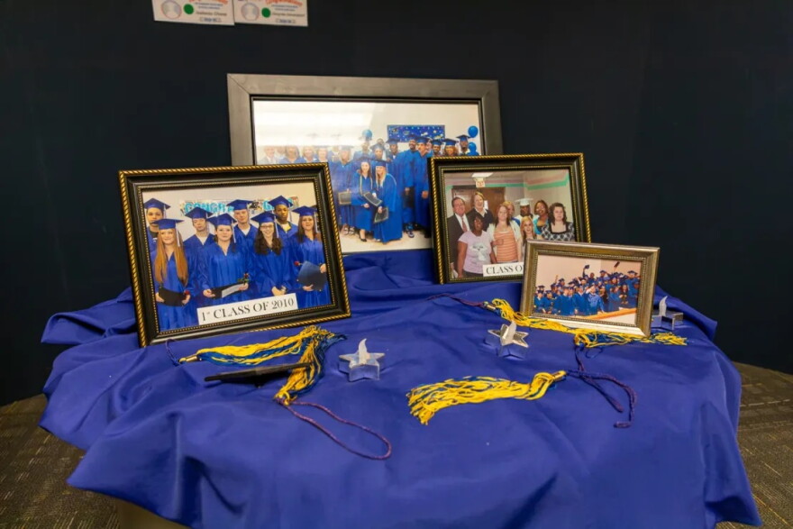 Pictures of past classes and tassels sit in the lobby of Goodwill Industries NexStep Alliance on July 27.