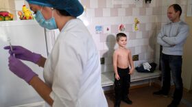 A nurse prepares a syringe for a measles vaccination at a pediatric clinic in Kiev, Ukraine. The country had 72,408 measles cases in the year from March 2018 to February 2019 — the highest number for any country during that period.