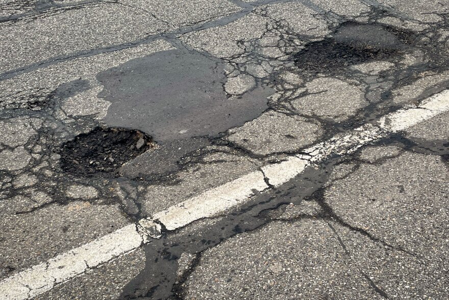 Potholes line 11400 South near 1000 East in Sandy, Utah, Jan. 16, 2023.