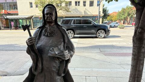 A statue of Carry Nation outside the building – the Eaton Place apartments