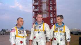Astronauts (left to right) Gus Grissom, Ed White, and Roger Chaffee, pose in front of Launch Complex 34 which is housing their Saturn 1 launch vehicle. The astronauts died ten days later in a fire on the launch pad. Photo: NASA