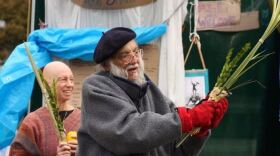 Photo of Rabbi Waskow benching Luvav from Slate.com;